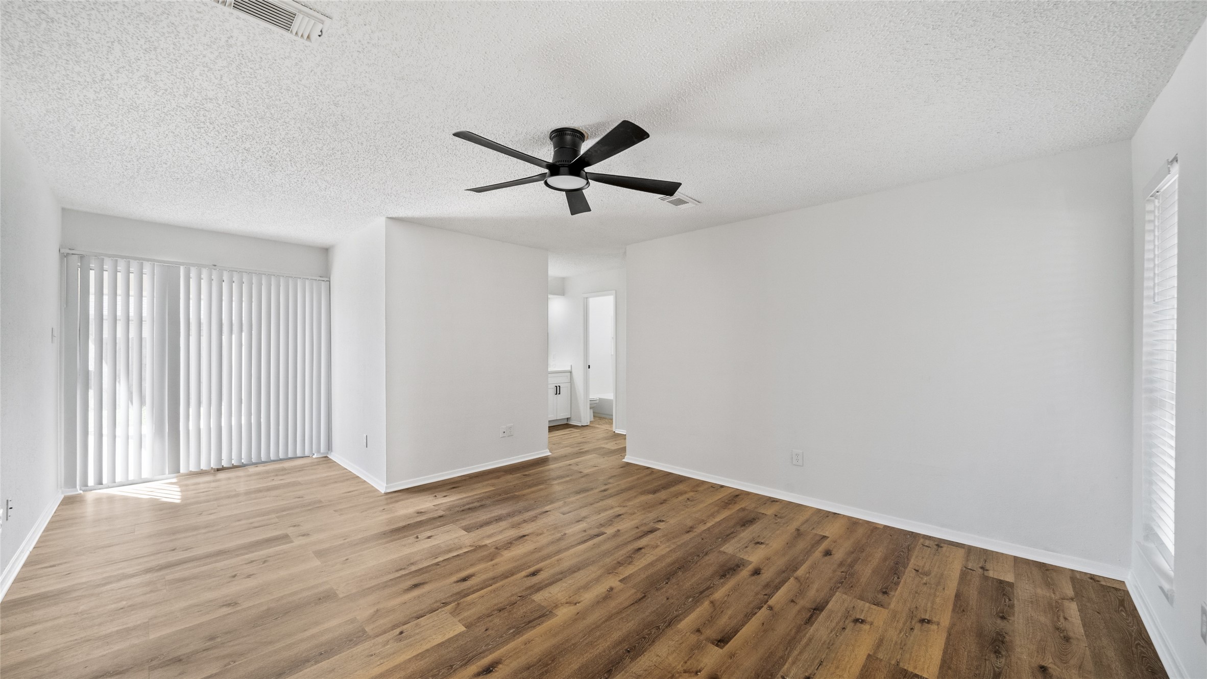 23414 Canyon Lake Drive Spring, TX 77373 - Photo 9 of 21 a view of a big room with wooden floor and windows in a room