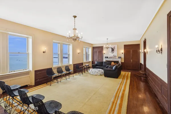 a bed room with two beds and a chandelier