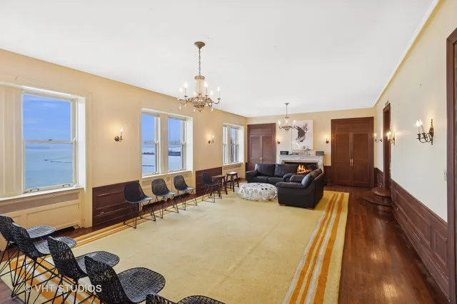 a bed room with two beds and a chandelier