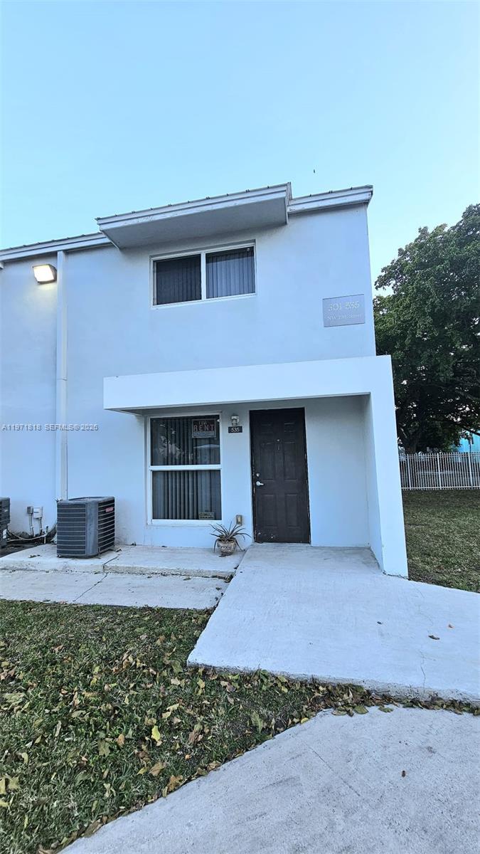 a front view of a house with yard