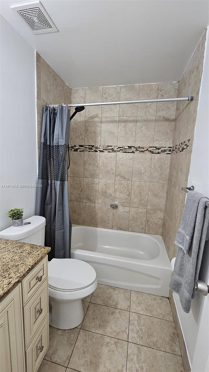 535 Northwest 19th Street, Unit 369 Miami, FL 33136 - Photo 12 of 26 a bathroom with a granite countertop sink toilet and shower