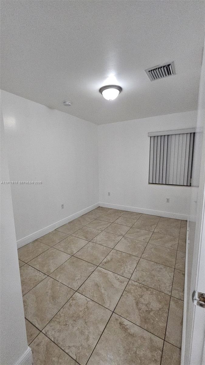 535 Northwest 19th Street, Unit 369 Miami, FL 33136 - Photo 15 of 26 a view of a livingroom with an empty space and a window
