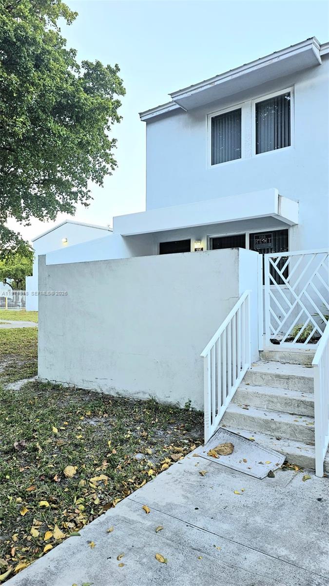 535 Northwest 19th Street, Unit 369 Miami, FL 33136 - Photo 2 of 26 a view of a house with a yard