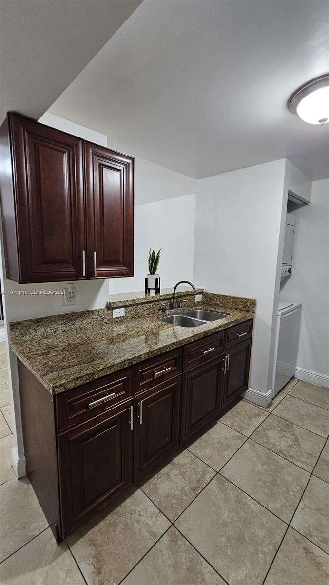 535 Northwest 19th Street, Unit 369 Miami, FL 33136 - Photo 22 of 26 a kitchen with granite countertop a sink and a stove