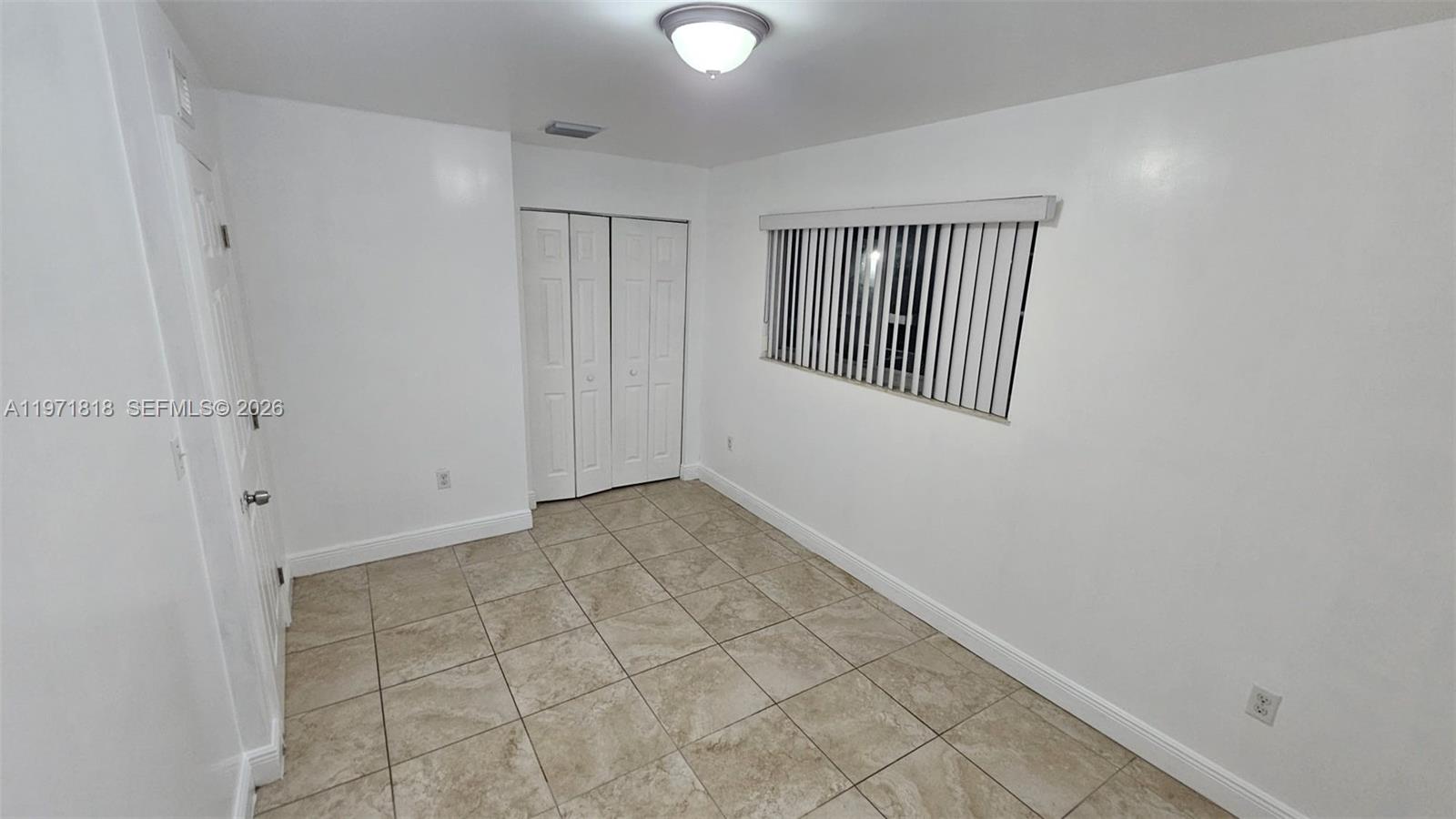 535 Northwest 19th Street, Unit 369 Miami, FL 33136 - Photo 24 of 26 a view of an empty room with windows