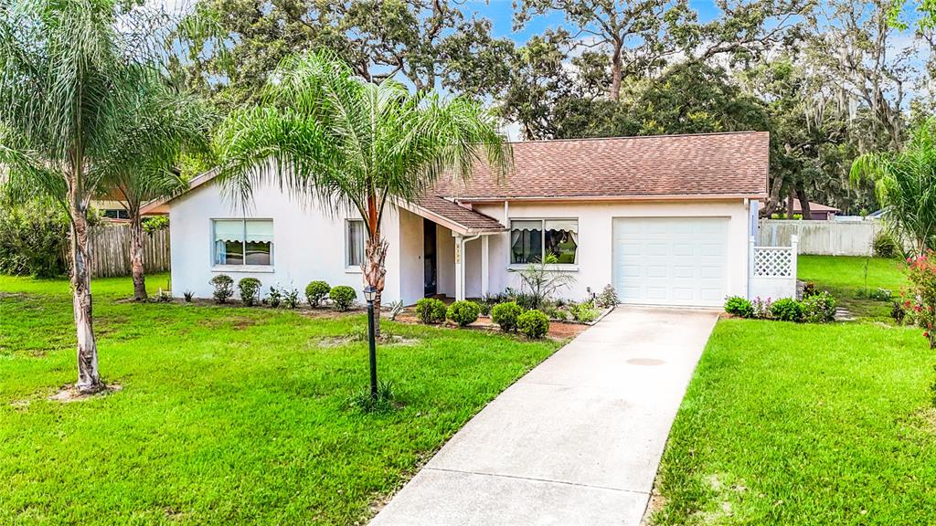 8388 Eldridge Road Spring Hill, FL 34608 - Photo 1 of 1 a front view of a house with a yard