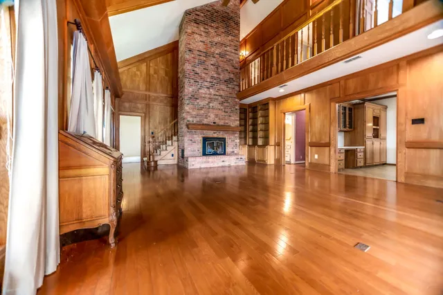 an entryway of a building with a floor to ceiling windows and yard