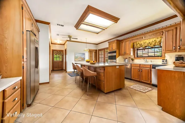a kitchen with a sink a counter top space and appliances