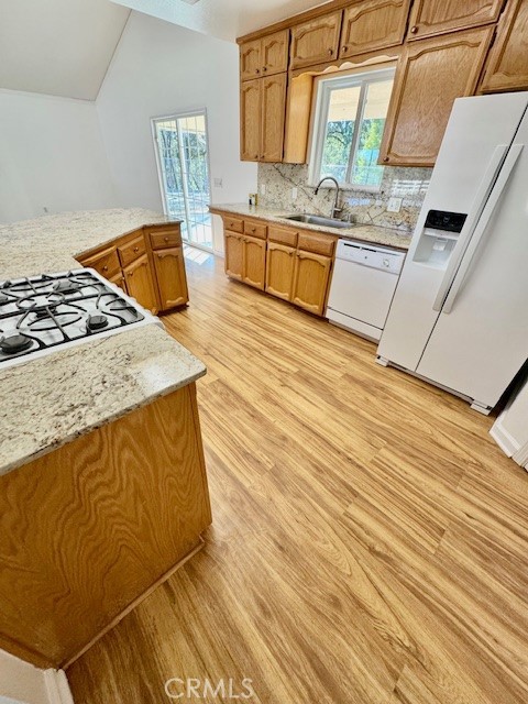 3589 Quail Ridge Drive Mariposa, CA 95338 - Photo 13 of 36 a kitchen with stainless steel appliances granite countertop a sink and wooden cabinets