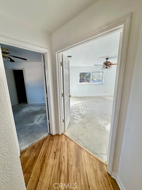 3589 Quail Ridge Drive Mariposa, CA 95338 - Photo 23 of 36 a view of a hallway with wooden floor