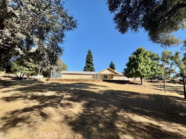 3589 Quail Ridge Drive Mariposa, CA 95338 - Photo 34 of 36 a view of a large body of water with a building in the background