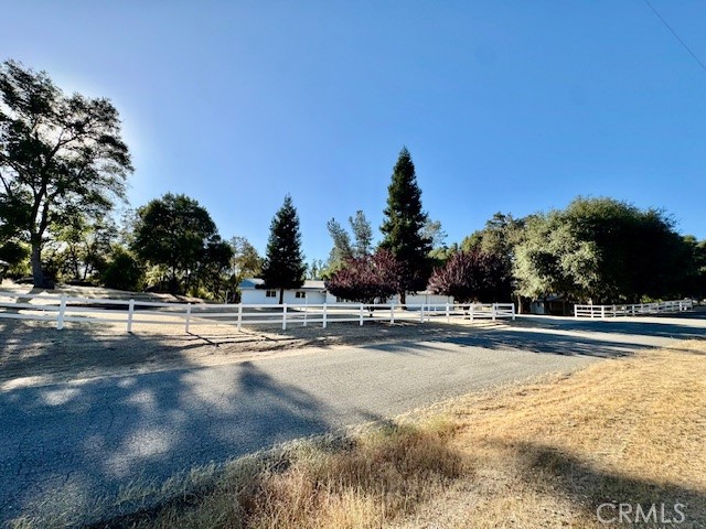 3589 Quail Ridge Drive Mariposa, CA 95338 - Photo 4 of 36 a view of a swimming pool and trees in the background