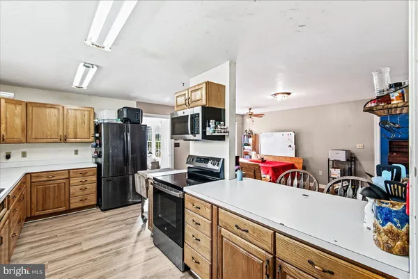 a kitchen with a sink and wooden cabinets