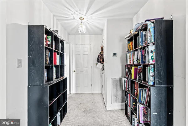 a view of entryway with workspace and window