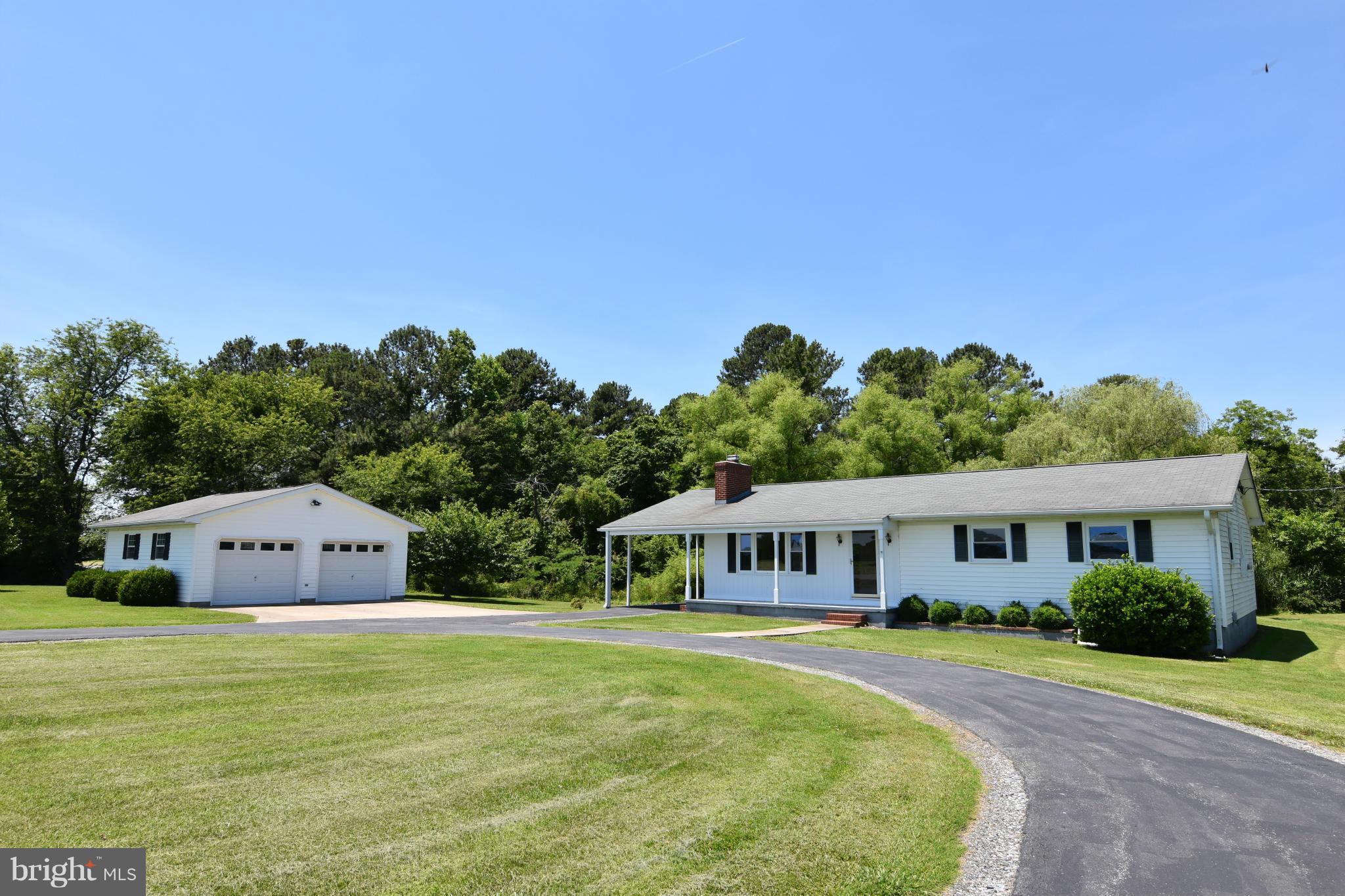 48632 Wynne Road Ridge, MD 20680 - Photo 1 of 30 a front view of house with yard and trees in the background