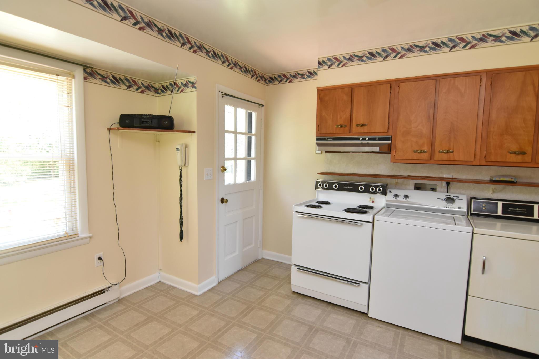 48632 Wynne Road Ridge, MD 20680 - Photo 10 of 30 a view of a kitchen with washer and dryer