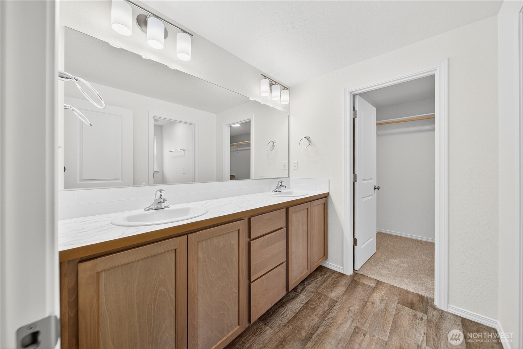 1903 Hickory Road Moses Lake, WA 98837 - Photo 11 of 12 a bathroom with a double vanity sink and a mirror