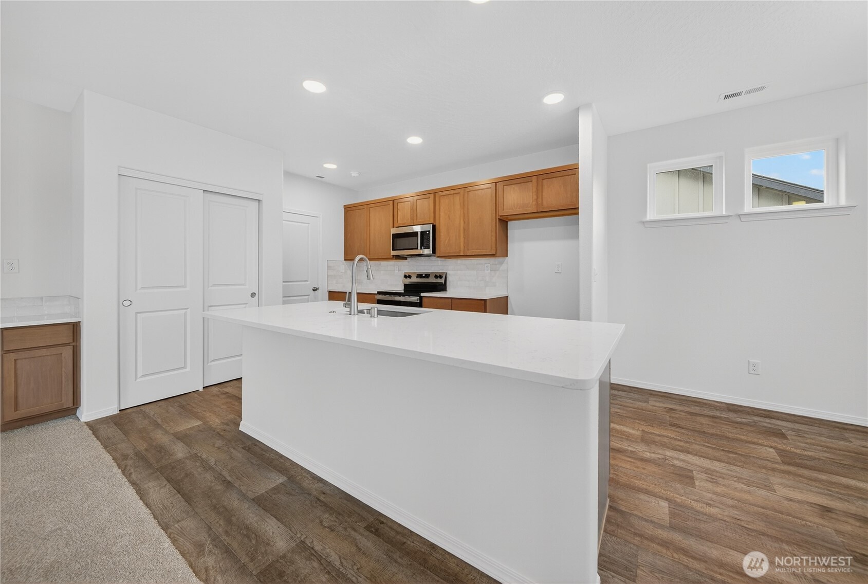 1903 Hickory Road Moses Lake, WA 98837 - Photo 3 of 12 a kitchen with stainless steel appliances a refrigerator sink and microwave