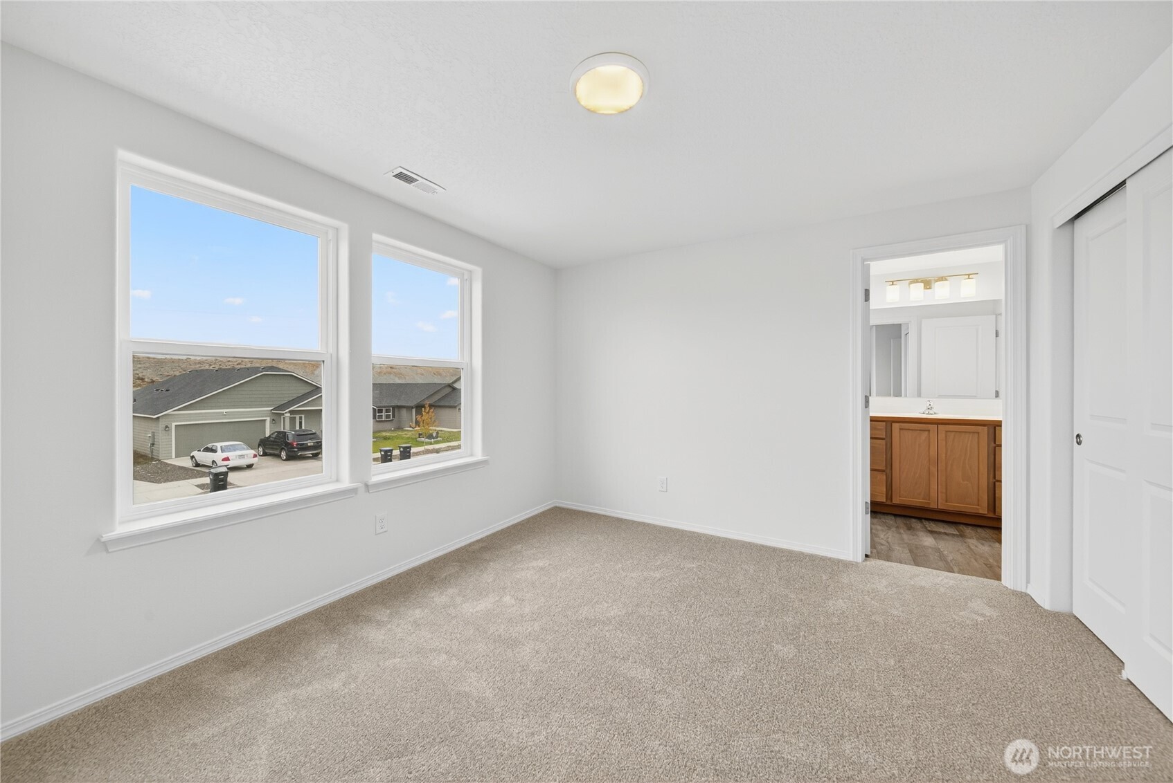 1903 Hickory Road Moses Lake, WA 98837 - Photo 8 of 12 a view of an empty room with a window