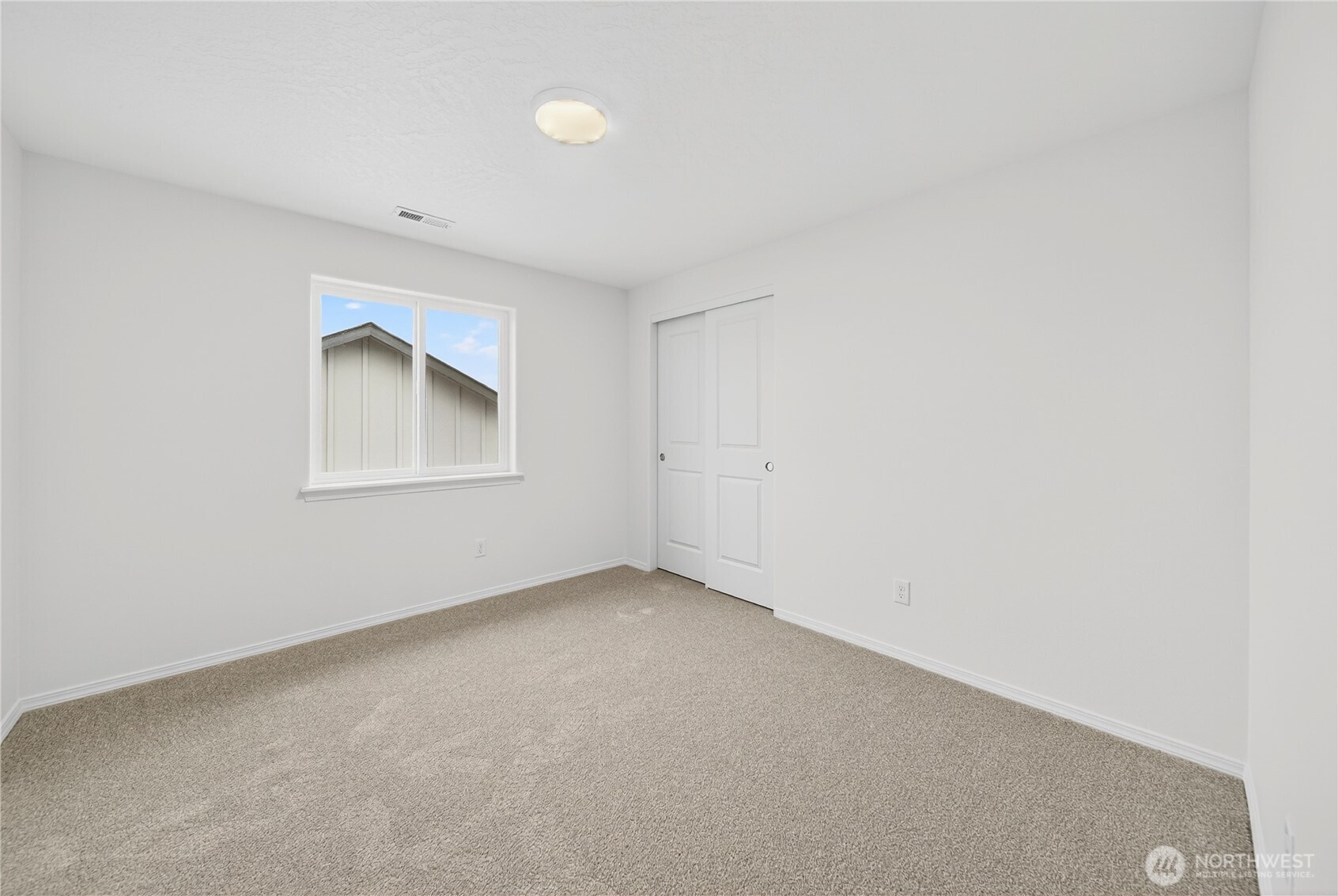 1903 Hickory Road Moses Lake, WA 98837 - Photo 10 of 12 an empty room with a window