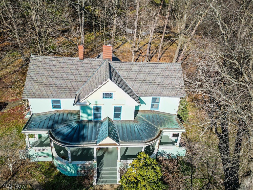 4041 Granger Road Akron, OH 44333 - Photo 29 of 34 A copper roof, gutters and downspouts cover the Veranda while the house is covered by a certified shingle roof with 40-year guarantee.