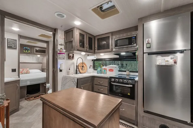 a kitchen with stainless steel appliances granite countertop a stove and a sink