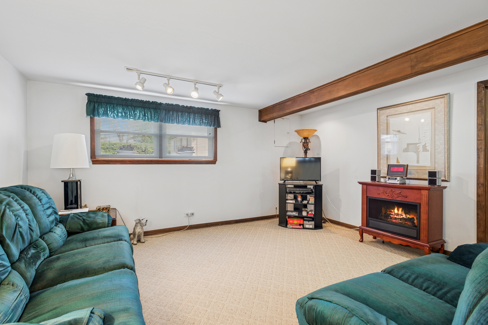 1725 Sycamore Street Des Plaines, IL 60018 - Photo 13 of 21 a living room with furniture and a fireplace