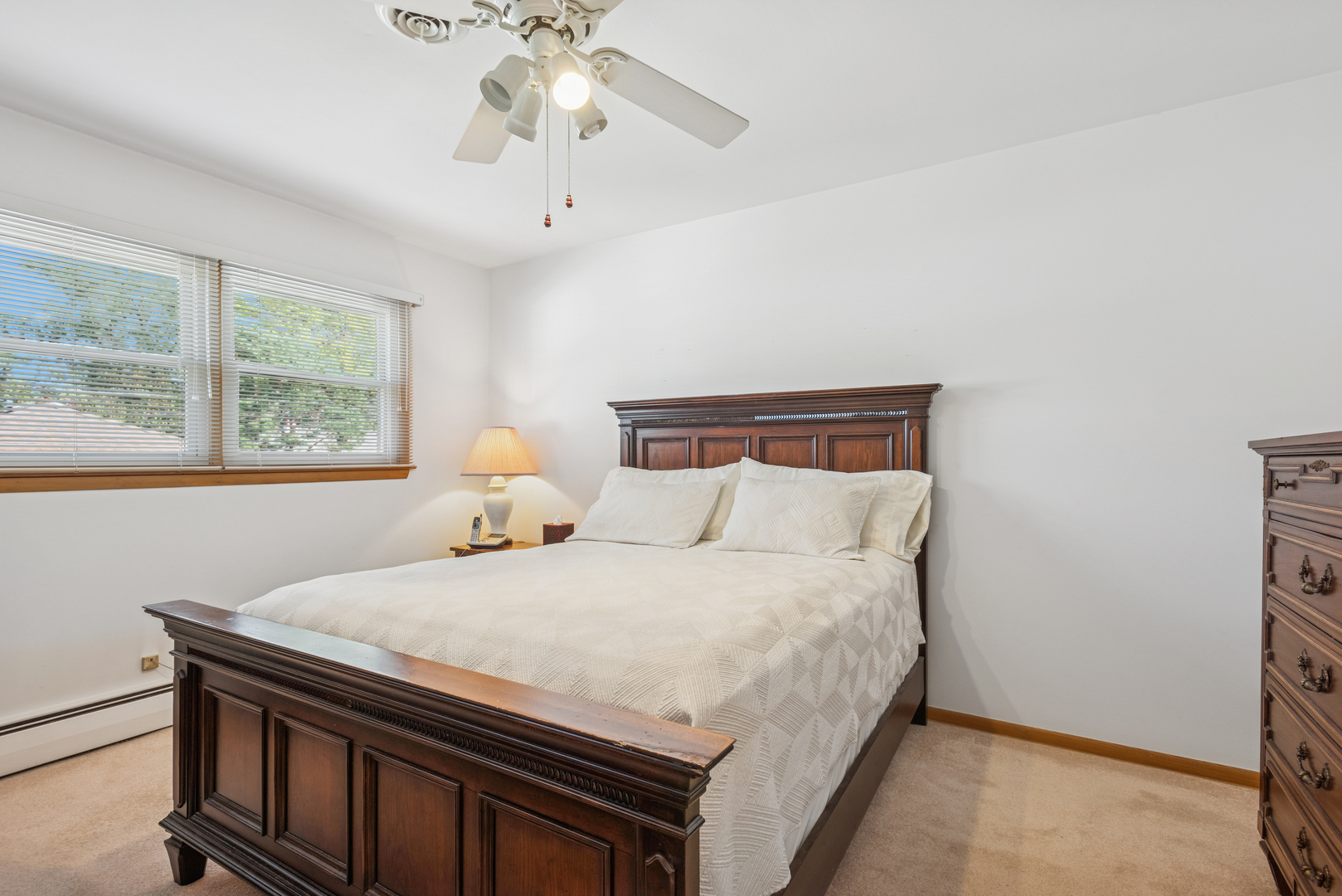 1725 Sycamore Street Des Plaines, IL 60018 - Photo 8 of 21 a bedroom with a bed and a window