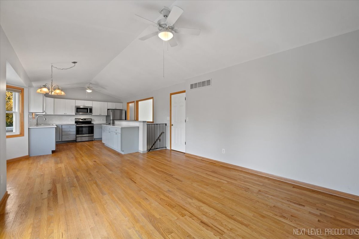 1146 Quail Run DeKalb, IL 60115 - Photo 11 of 31 a view of kitchen with wooden floor