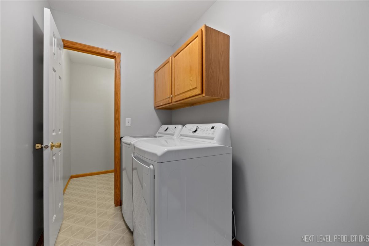 1146 Quail Run DeKalb, IL 60115 - Photo 12 of 31 a utility room with dryer and washer