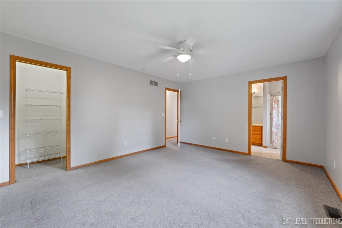 1146 Quail Run DeKalb, IL 60115 - Photo 15 of 31 an empty room with closet and a ceiling fan