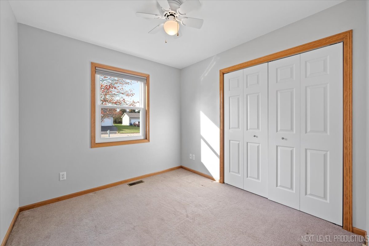1146 Quail Run DeKalb, IL 60115 - Photo 18 of 31 a view of an empty room with a window