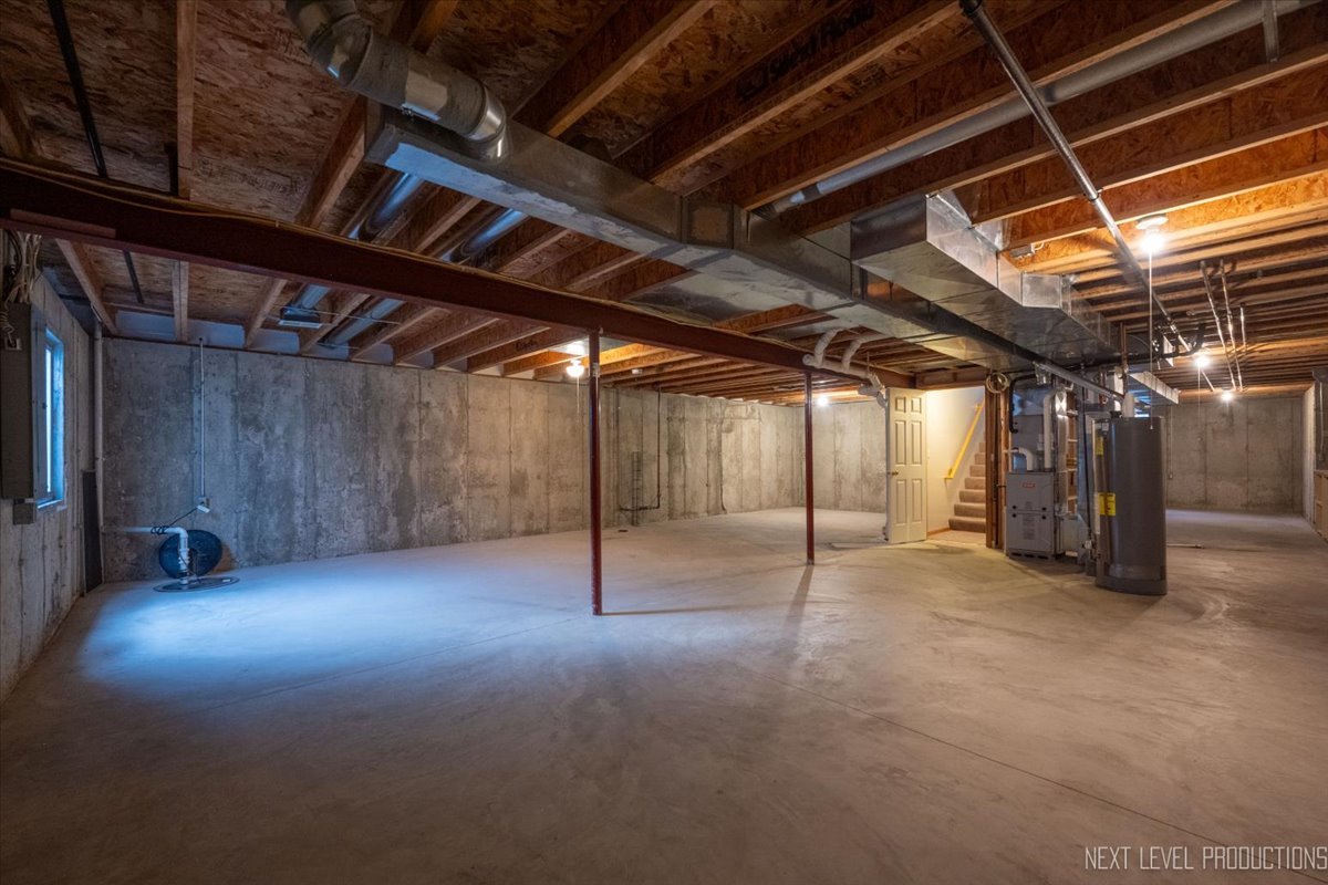 1146 Quail Run DeKalb, IL 60115 - Photo 21 of 31 a view of empty room with wooden walls