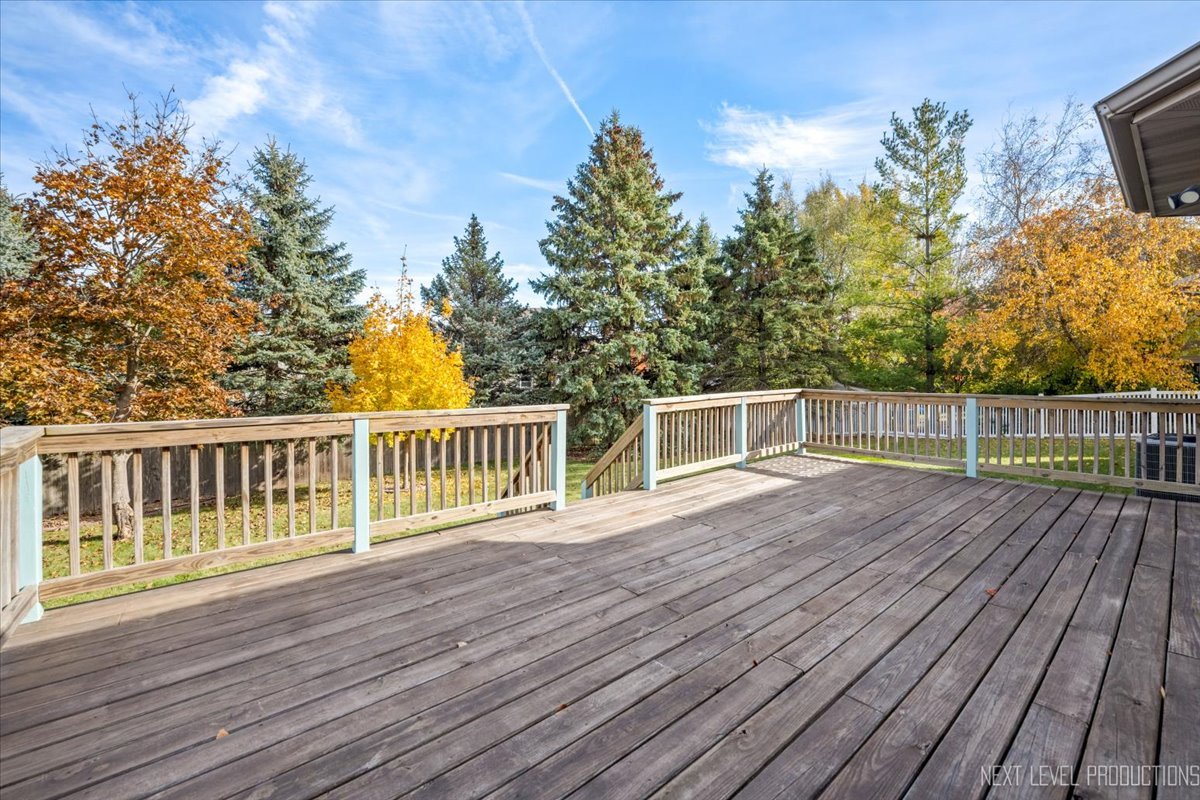 1146 Quail Run DeKalb, IL 60115 - Photo 23 of 31 a view of house with deck and wooden floor