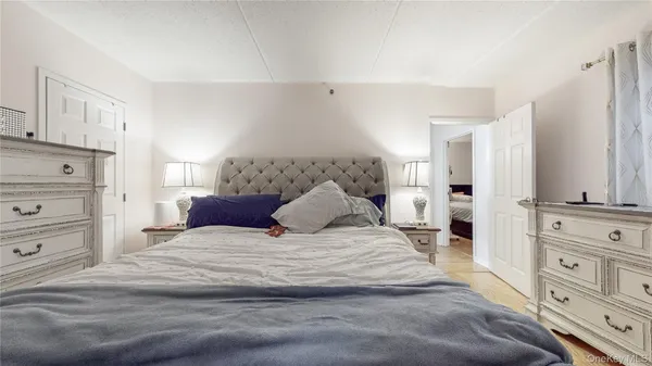 a large white bed in a white room
