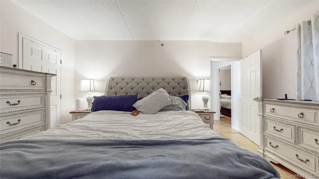 a large white bed in a white room