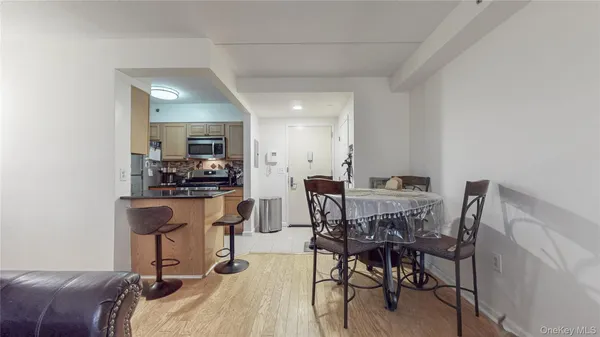 a view of a dining room with furniture and a table