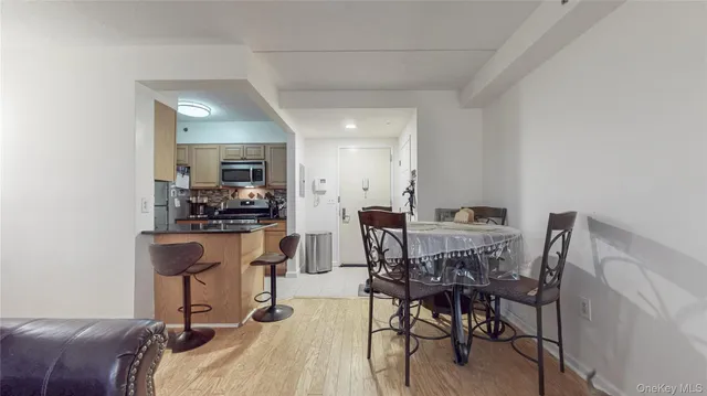 a view of a dining room with furniture and a table