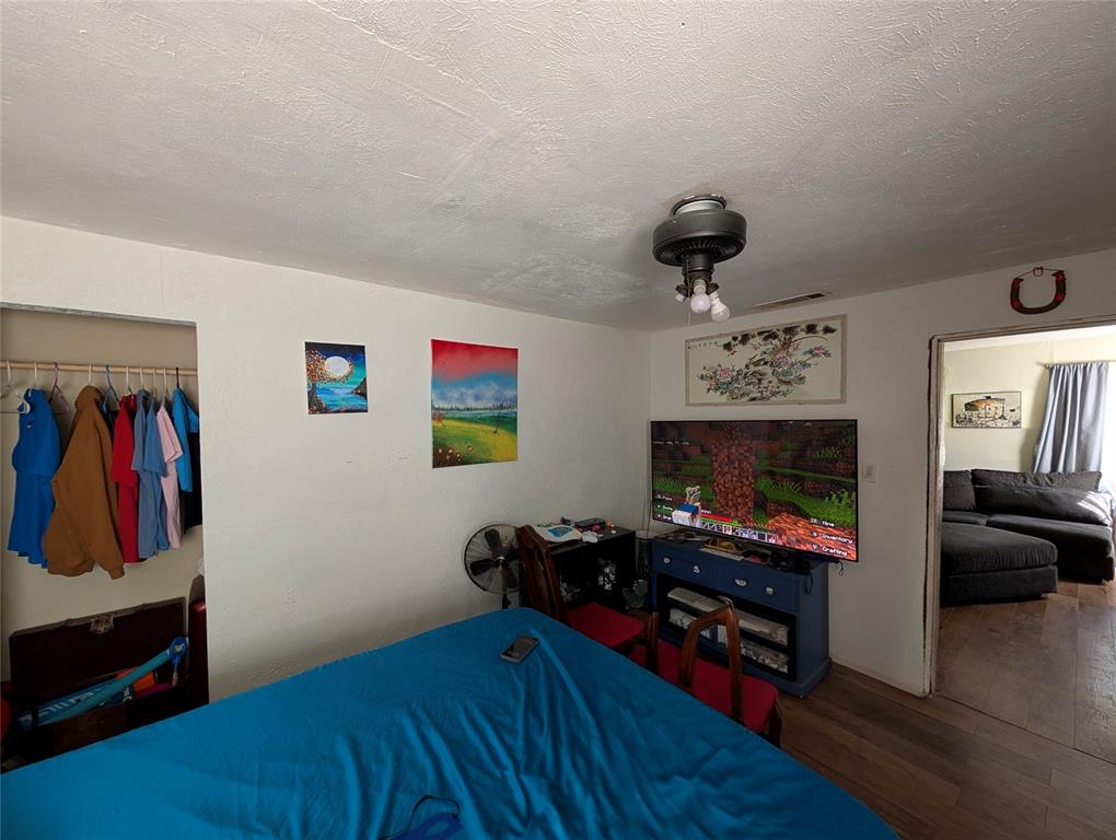 308 Short Street Mansfield, TX 76063 - Photo 7 of 21 a bedroom with furniture and a wooden floor