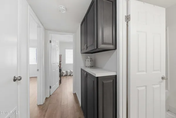a kitchen with a refrigerator and a sink