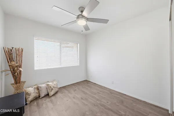 a view of room with window and ceiling fan