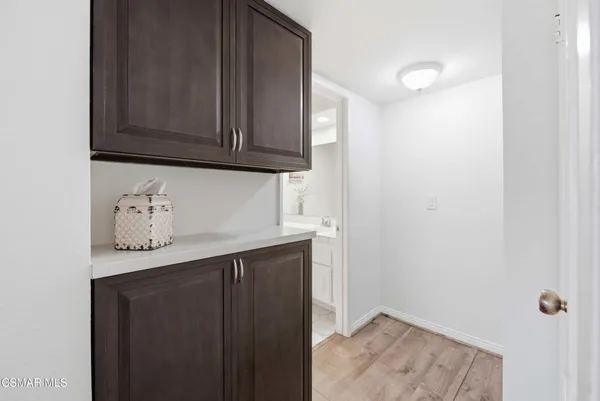 a view of a porch with furniture and garden