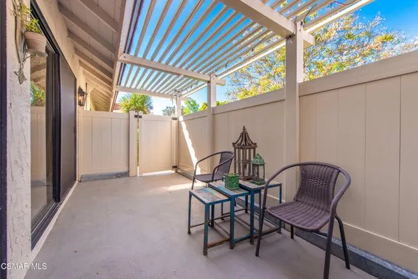 a dining room with furniture and a chandelier