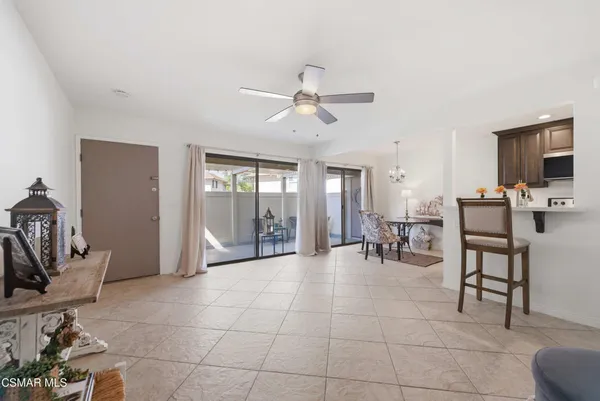 a room with lots of chairs and mirrors