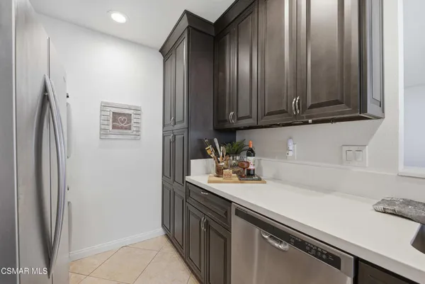 a kitchen with stainless steel appliances a refrigerator and a sink
