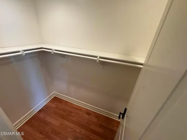 an empty room with wooden floor