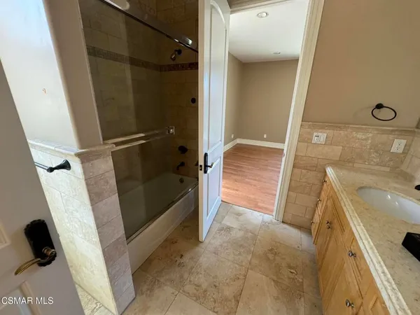 a bathroom with a sink a toilet and a shower