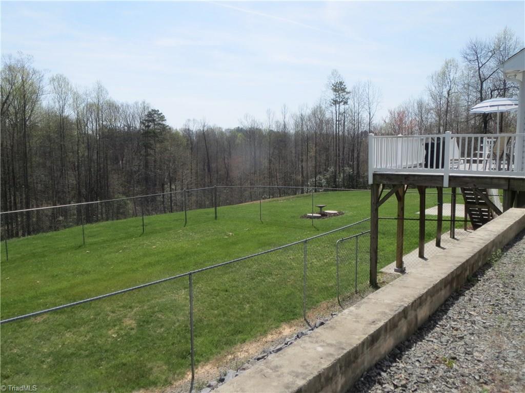 2212 Little Elkin Church Road Ronda, NC 28670 - Photo 11 of 30 View of fenced area, back yard and deck.