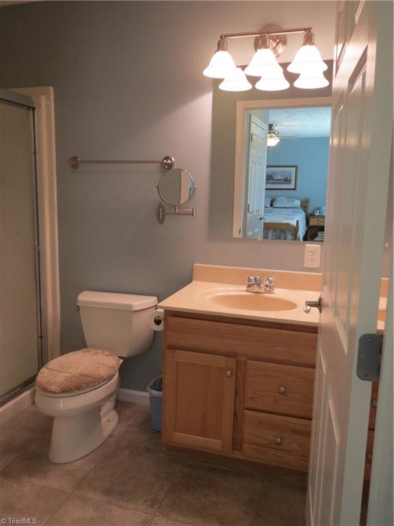 2212 Little Elkin Church Road Ronda, NC 28670 - Photo 18 of 30 Master bath with tile floor, walk-in shower.