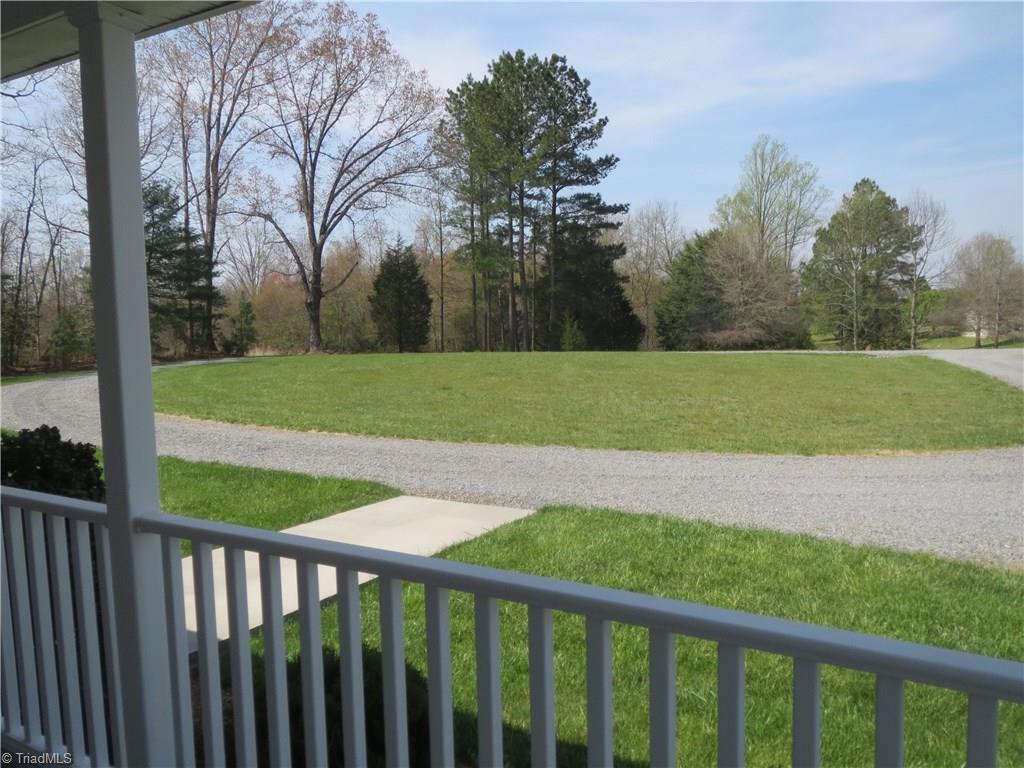 2212 Little Elkin Church Road Ronda, NC 28670 - Photo 3 of 30 View from covered front porch of level front yard and circular drive.